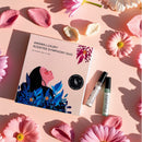 “Awawa Luxury Scented Symphony Duo gift box with Bloomé and Fleuréa vials on pink backdrop with flowers”