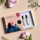 “Open Scented Symphony Duo gift set with Bloomé and Fleuréa minis on textured background with flowers”