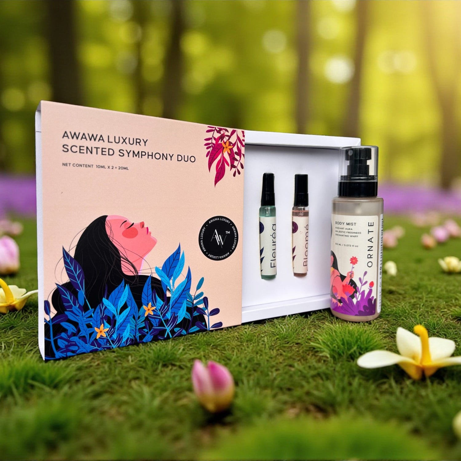 “Scented Symphony Duo gift box with Bloomé and Fleuréa vials and Ornate body mist on garden grass”